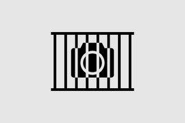 Auf der Grafik ist zu sehen das Symboldbild einer Kamera hinter Gittern.
